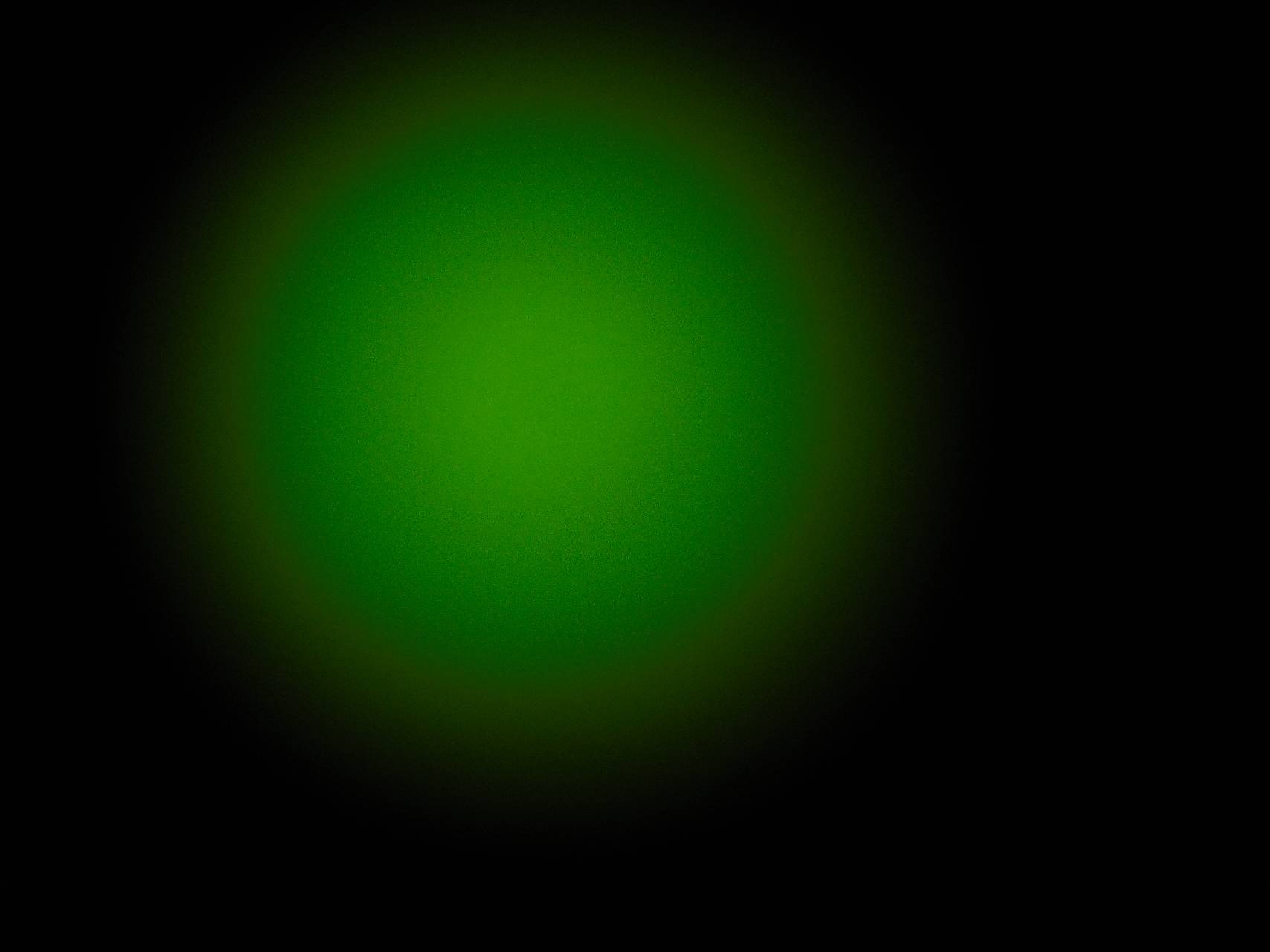 Светящаяся точка на экране. Салатовый градиент. Зеленое свечение. Темно зеленый фон. Свеча зеленая.